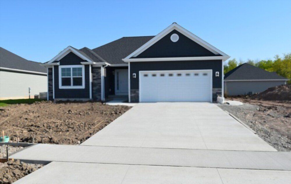 a day-old plain concrete driveway done by Palm Beach Stamped Concrete pros