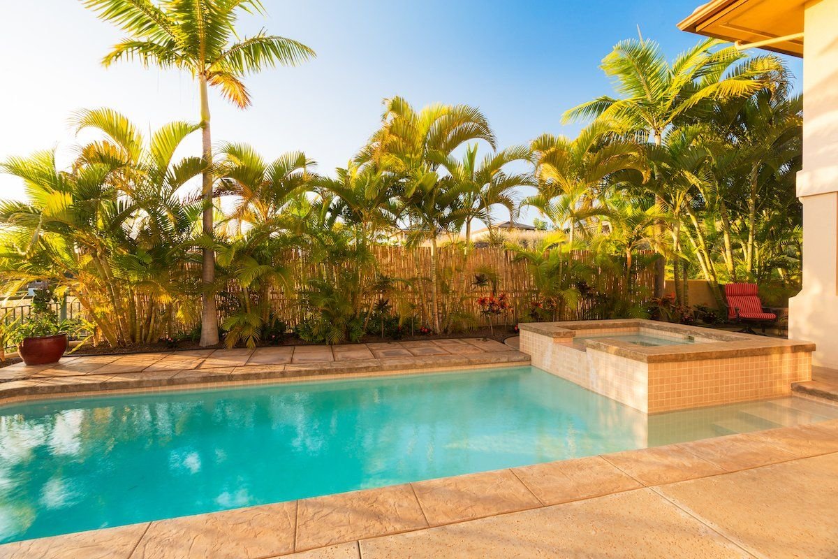 attractive travertine pool deck in a West Palm Beach Fl residential property