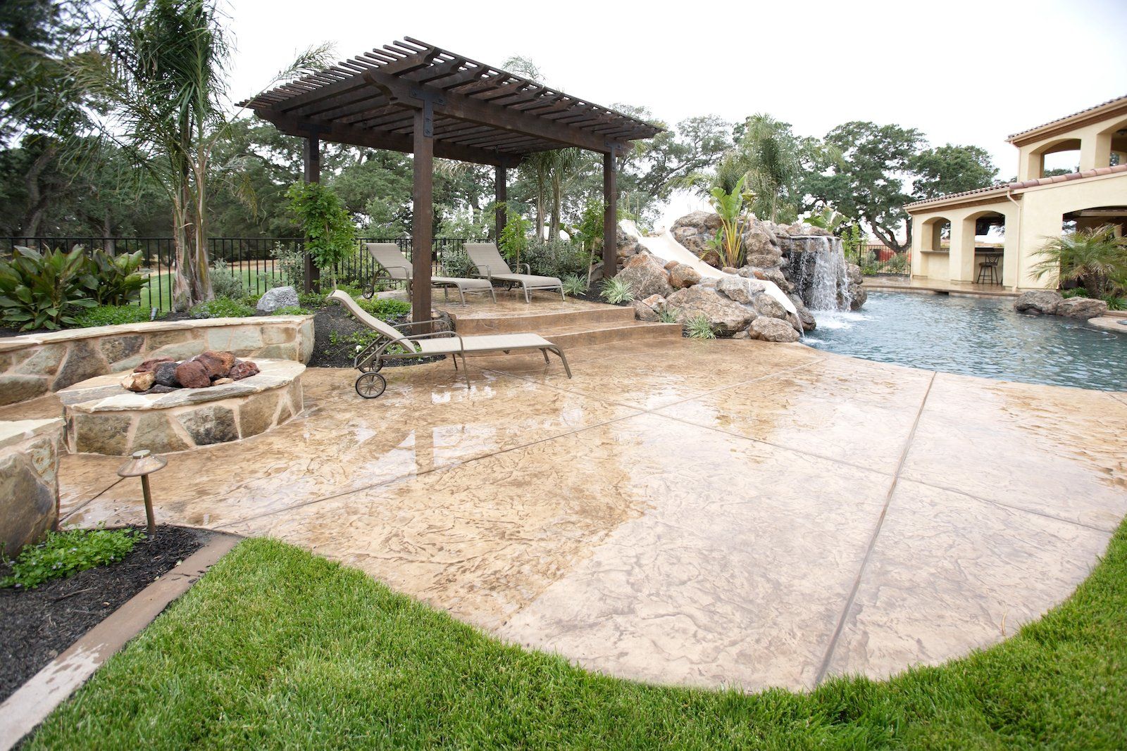 this Delray Beach FL residential pool is shining in this aesthetically pleasing and slip-resistant stamped concrete deck